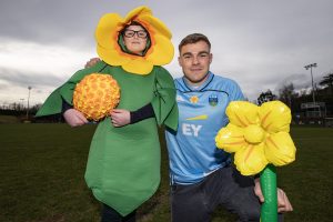 The UCD Rugby Daffodil Day mascot with Irish Rugby and Leinster Rugby's Garry Ringrose